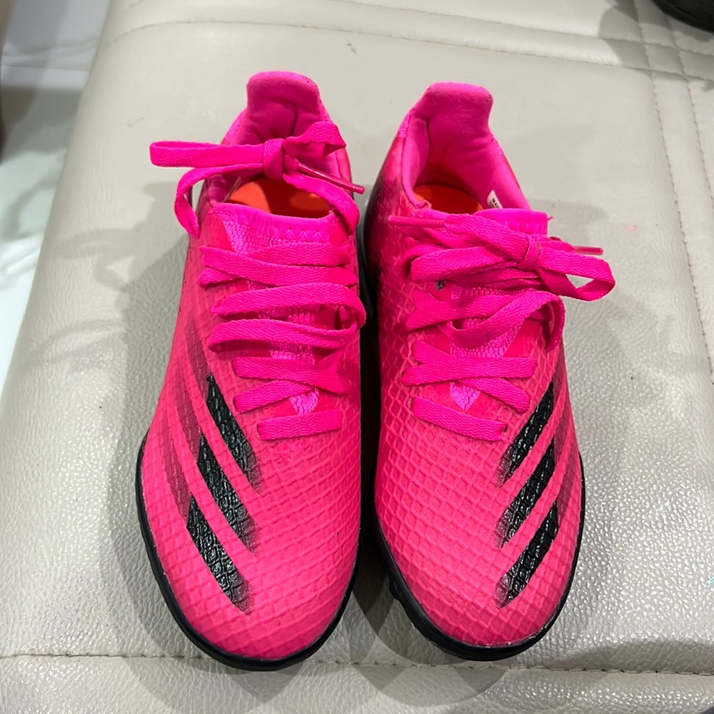 Hot pink and black soccer shoes. Male/Boys size 12